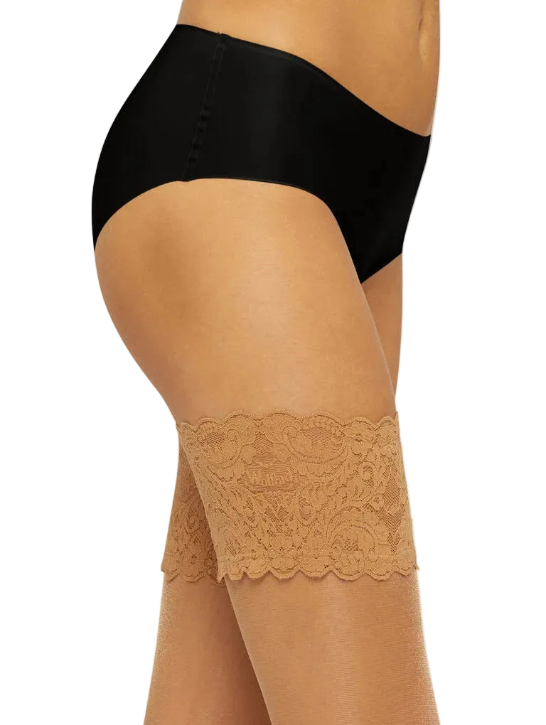 Black lingerie and beige lace hold upson a white background