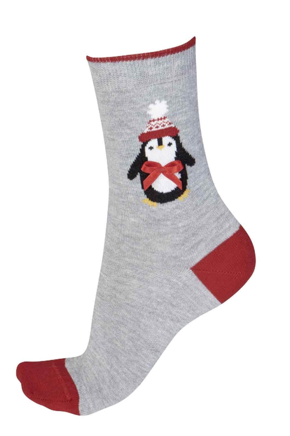 Gray sock with a penguin design on a white background