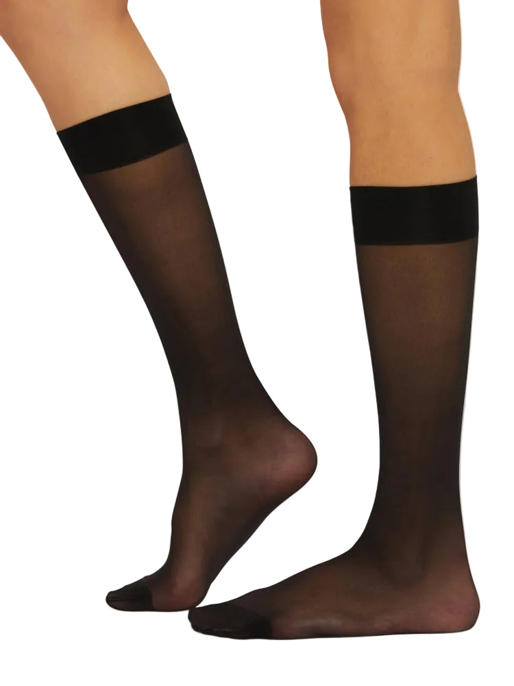 Black knee-high socks worn by a model on a white background