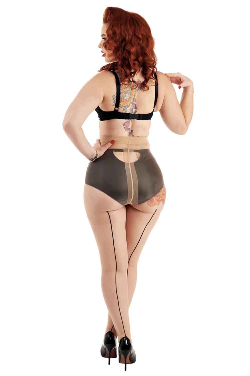 Model wearing a black bra and jive seamed tights in nude/black  on a white background