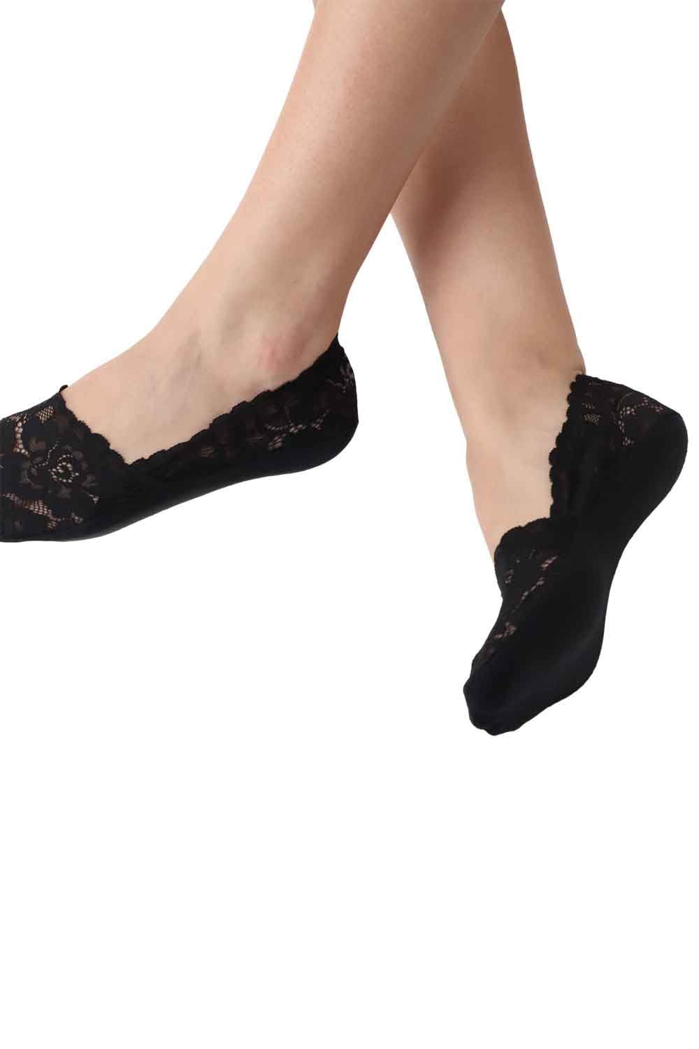 Black lace socks worn by a person on a white background