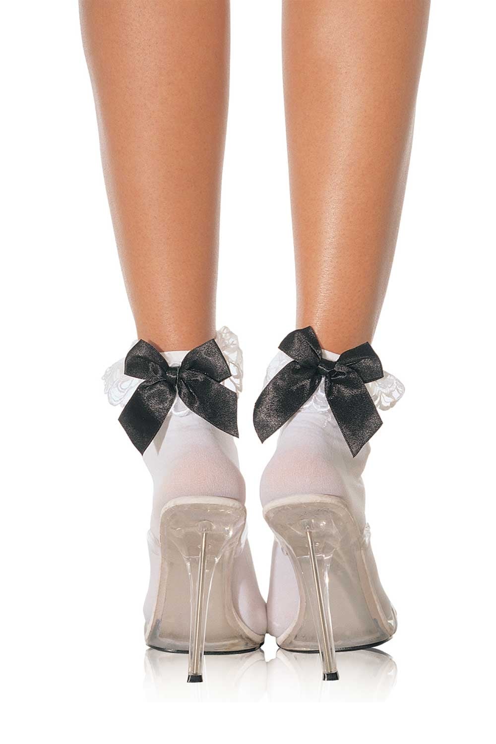 White high-heeled shoes with white socks and  black bows on a white background