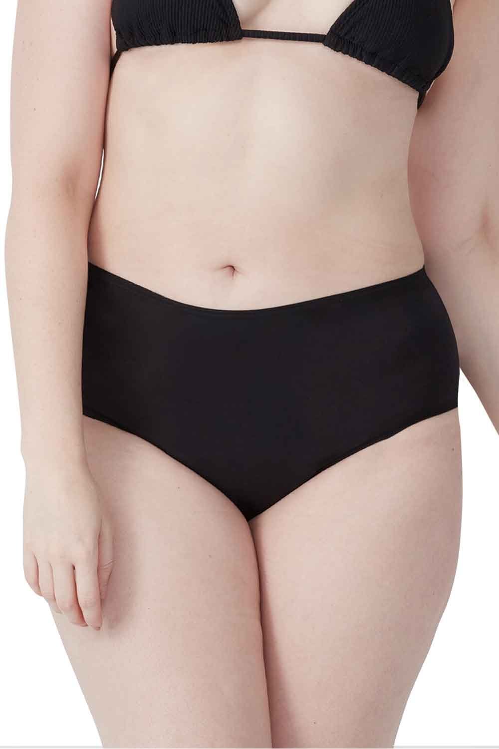 Person wearing a  black love  luna period swim full brief on a white background