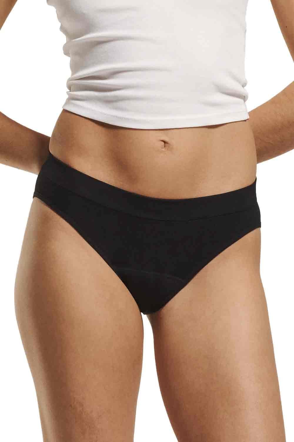 Person wearing black love luna teens  first seamfree period bikini briefs on a white background 
