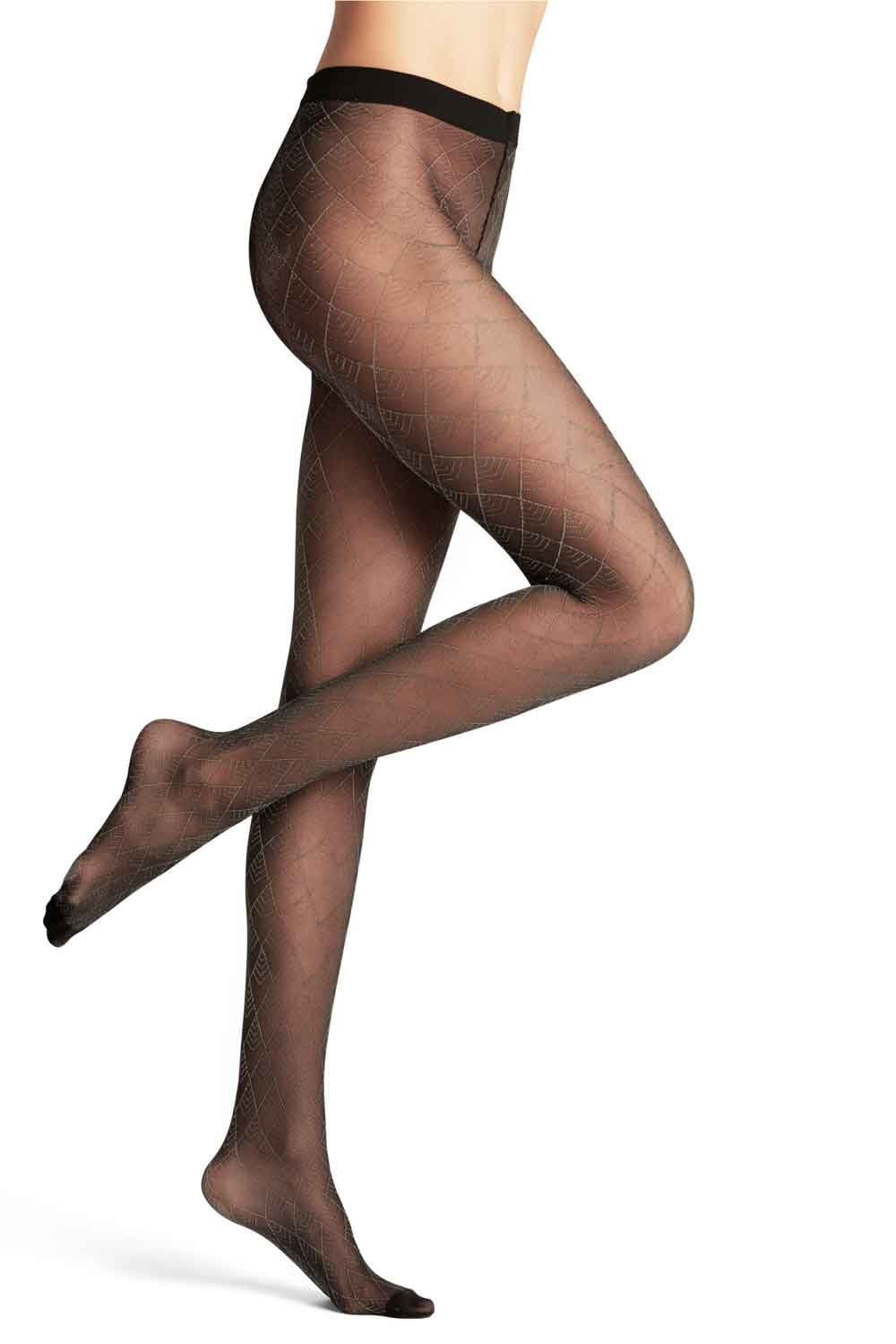 Black /gold patterned tights worn by a person on a white background