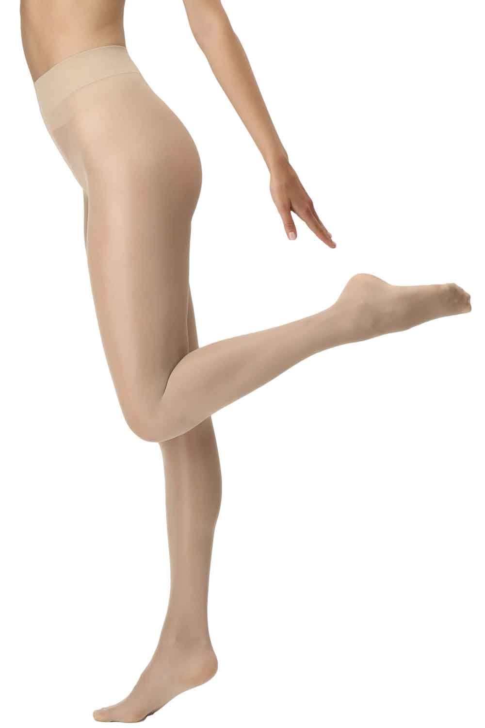 Nude look skin coloured tights worn by a person on a white background