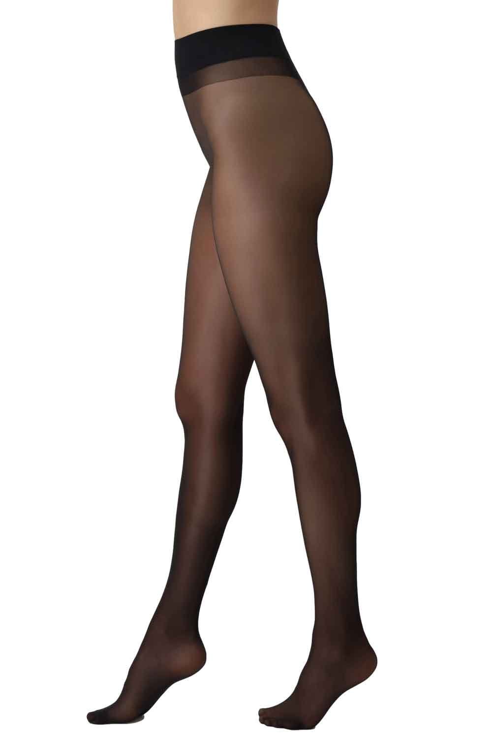 Black tights worn by a person on a white background