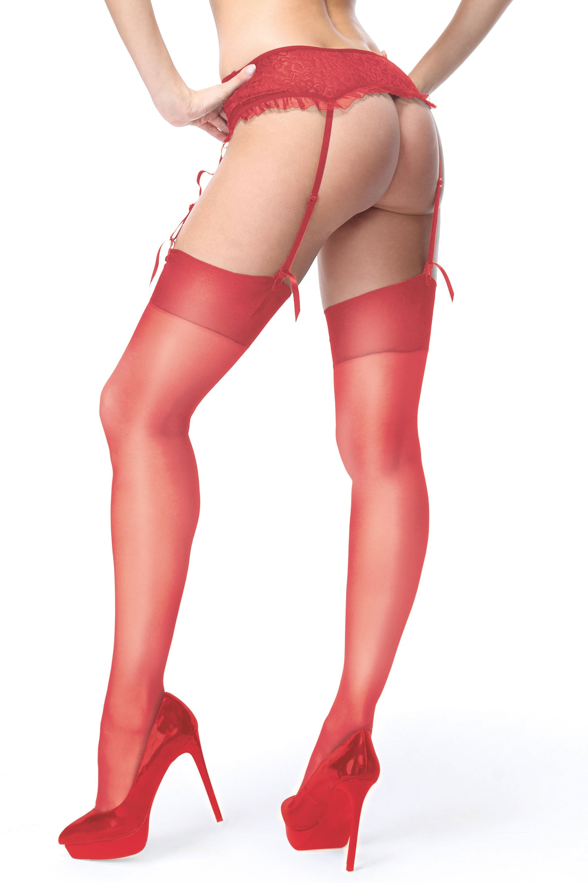 Red lace lingerie set with stockings and high heels on a white background