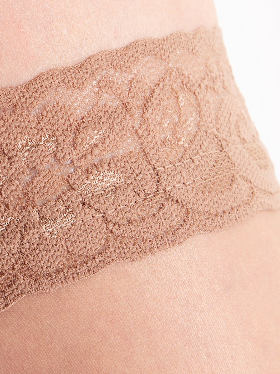 Close-up of a lace-trimmed  hold up in a sherry colour