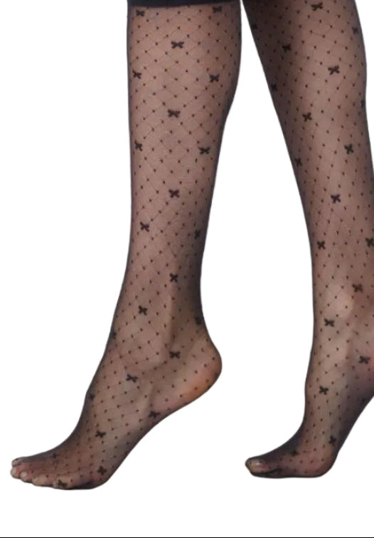 Black patterned  bow design tights  worn by a person on a white background