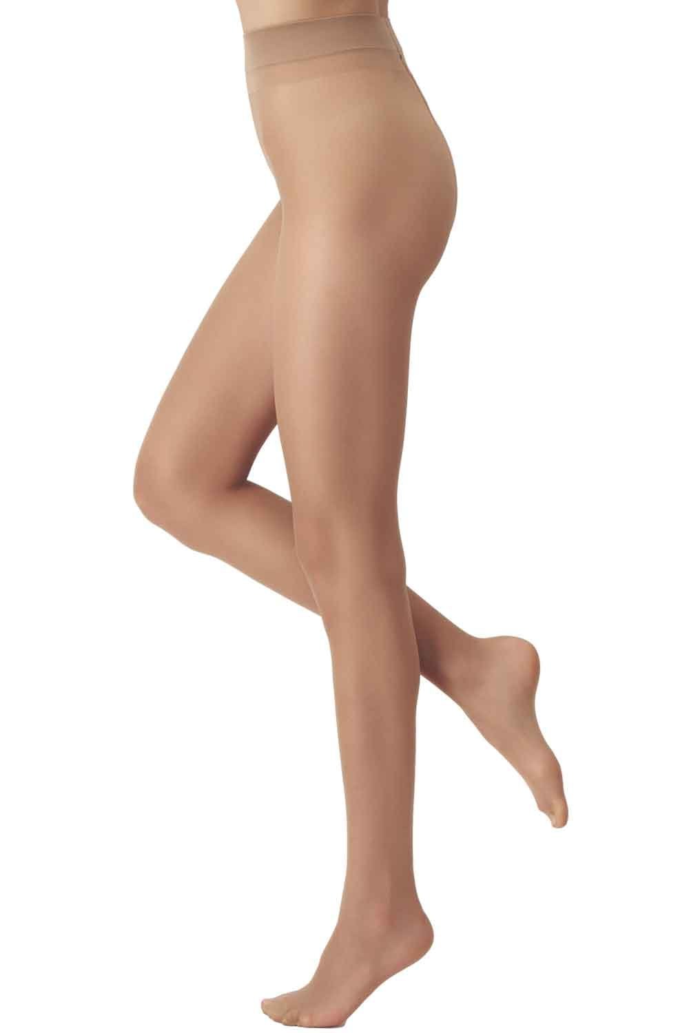 Beige tights worn by a model on a white background
