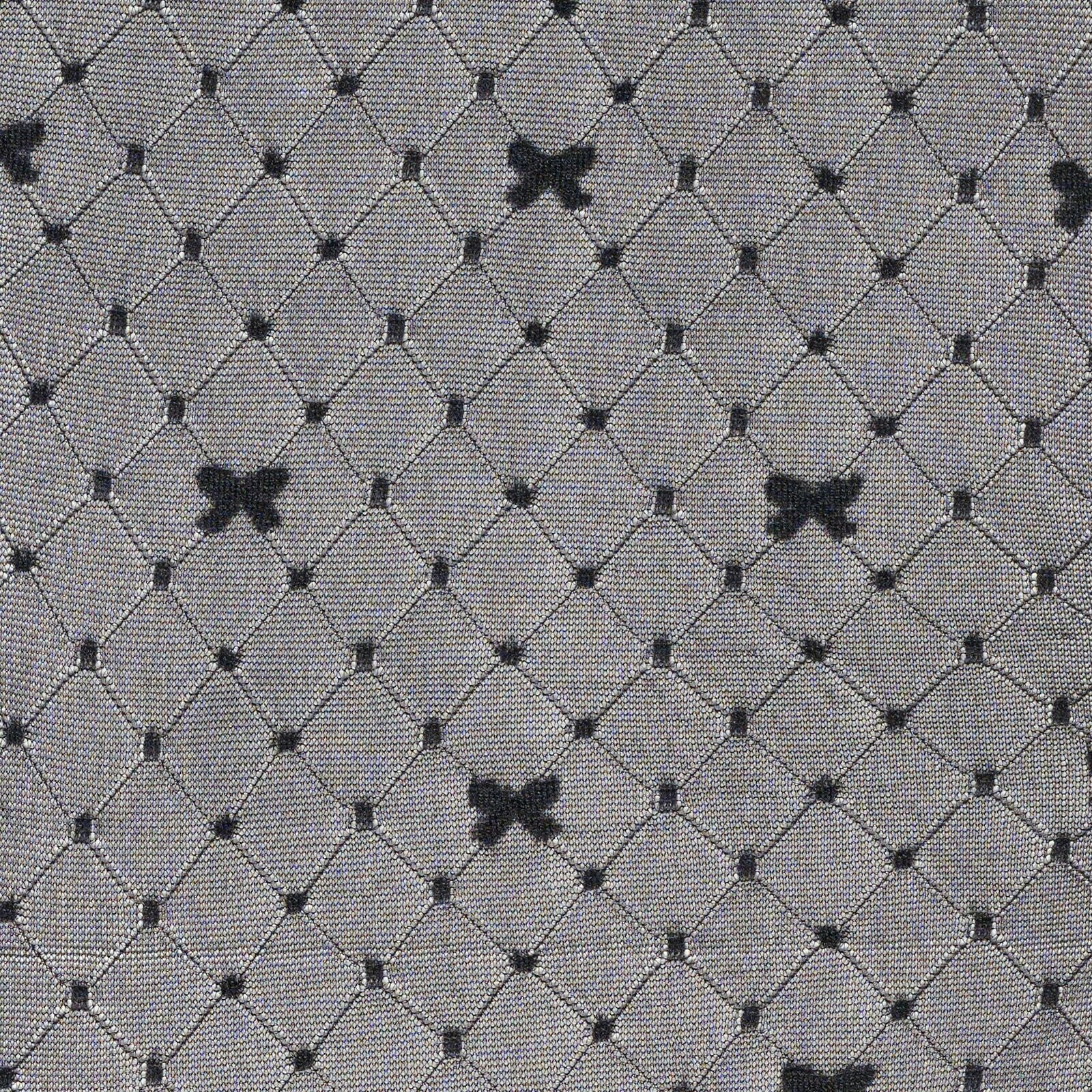 Black bow  patterned tights  on a gray textured fabric background