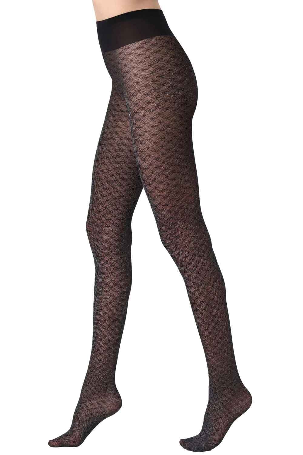 Black sparkly lace  tights worn by a person on a white background