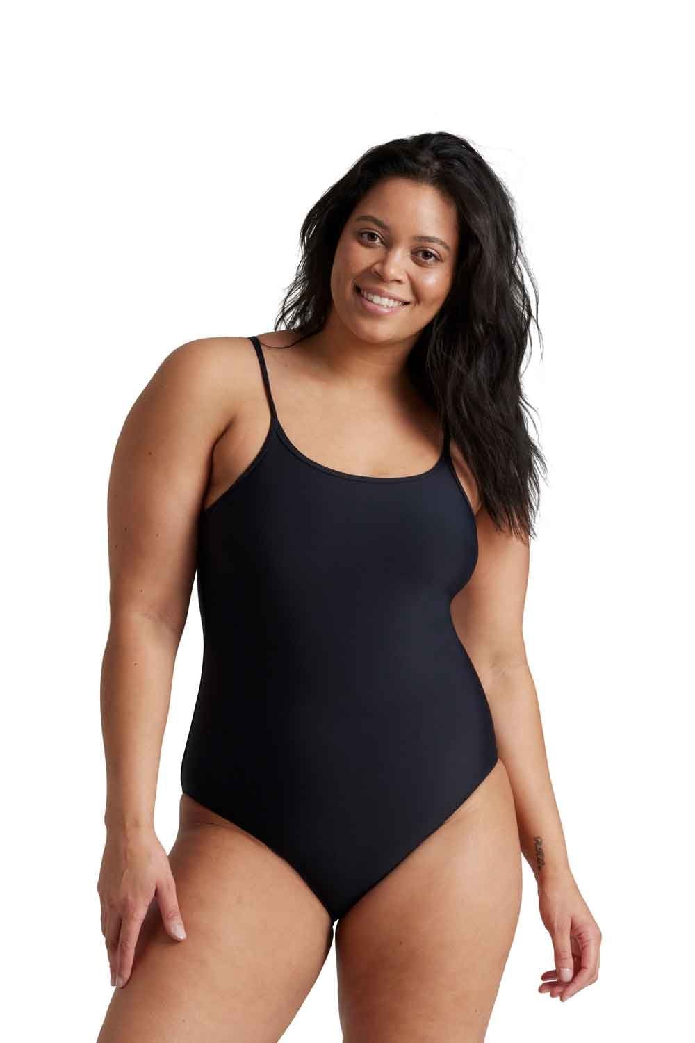 Woman wearing a black
 period  one-piece swimsuit  by love luna on a white background