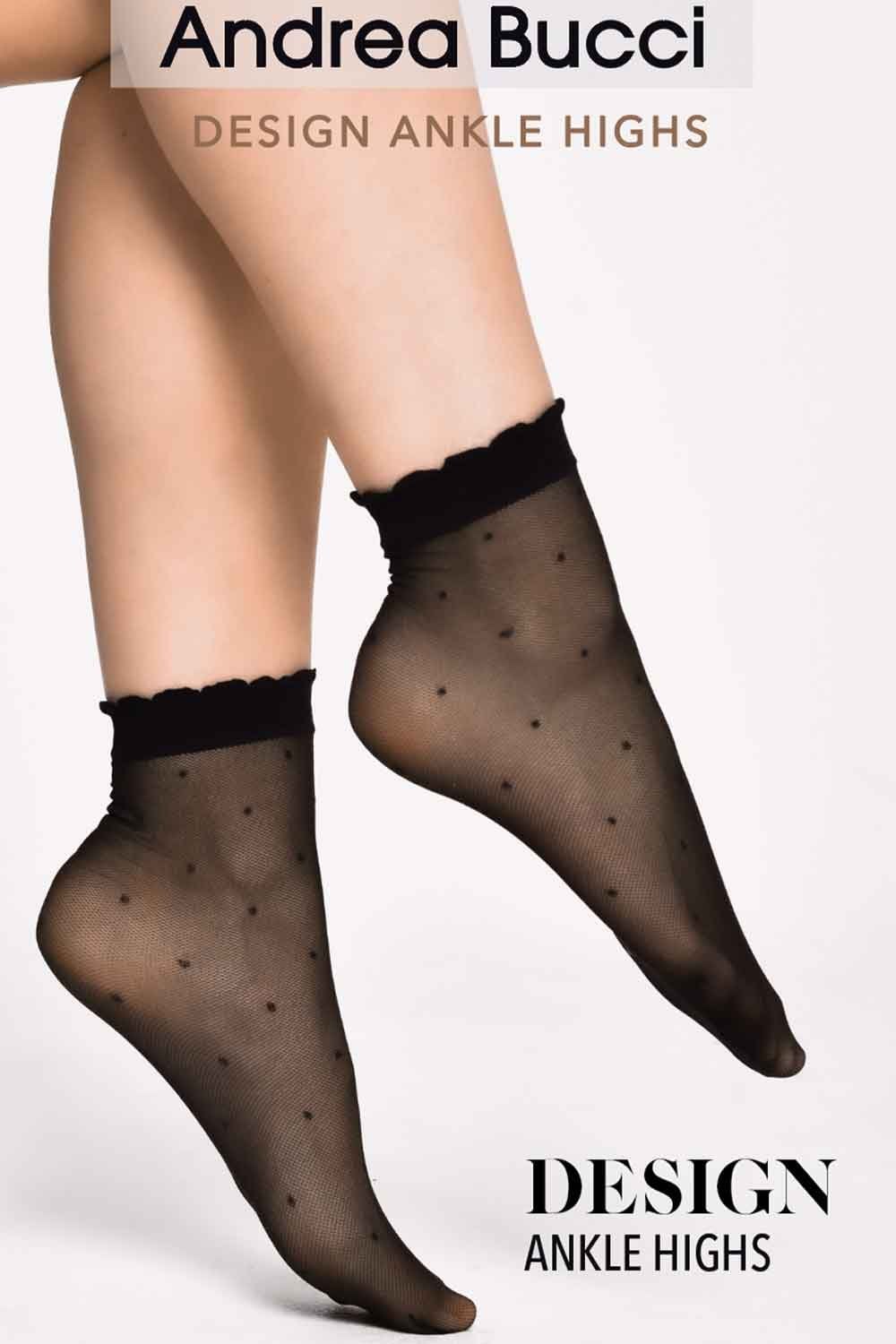 Black ankle-high socks with dot pattern worn by a person on a white background, featuring Andrea Bucci branding.