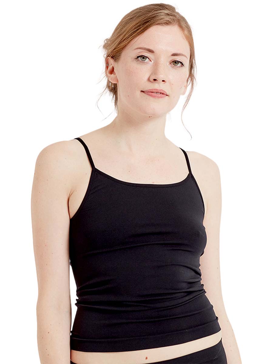 Woman wearing a black cami vest on a white background
