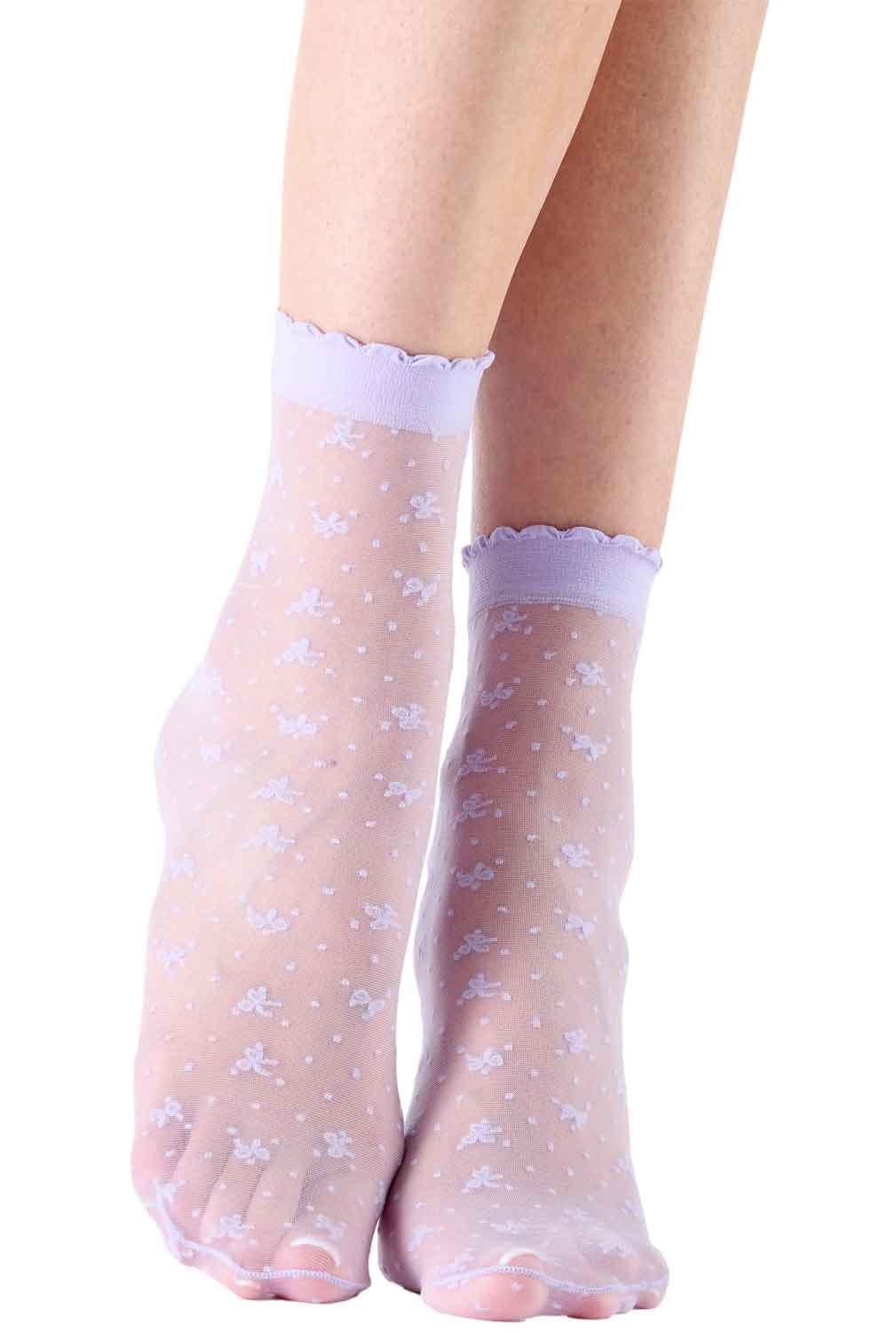 Sheer socks with  floral pattern worn by a person on a white background
