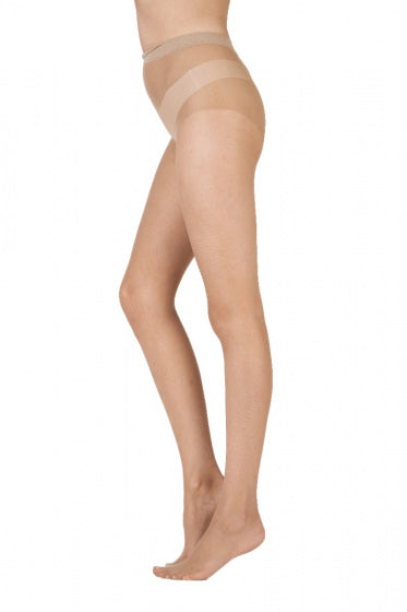 Nude coloured tights on a white background