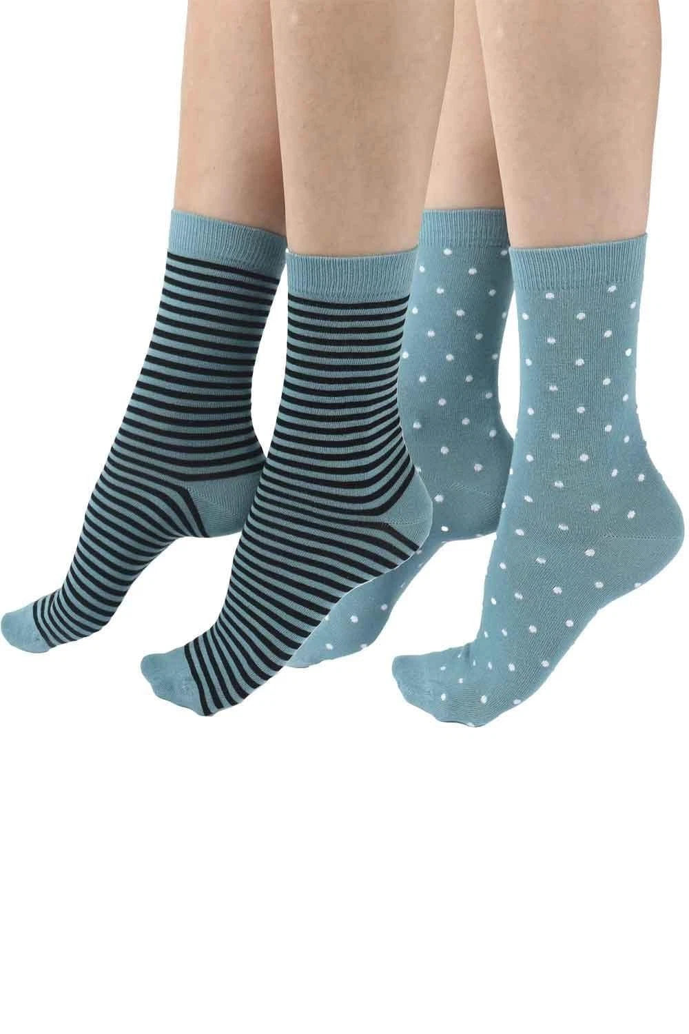 Two pairs of green socks, one striped and one with white polka dots, on a white background.