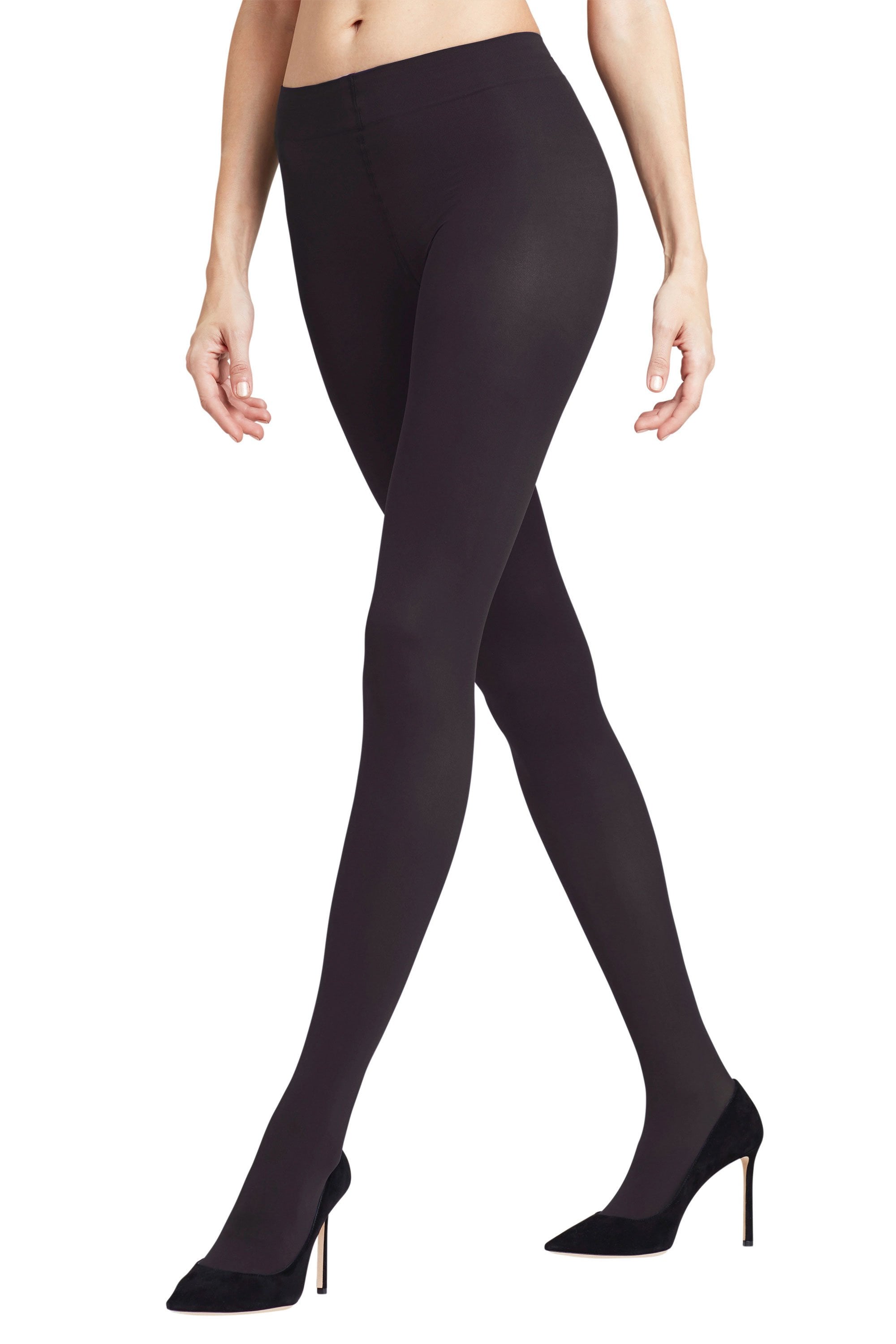 Black falke tights worn by a model on a white background