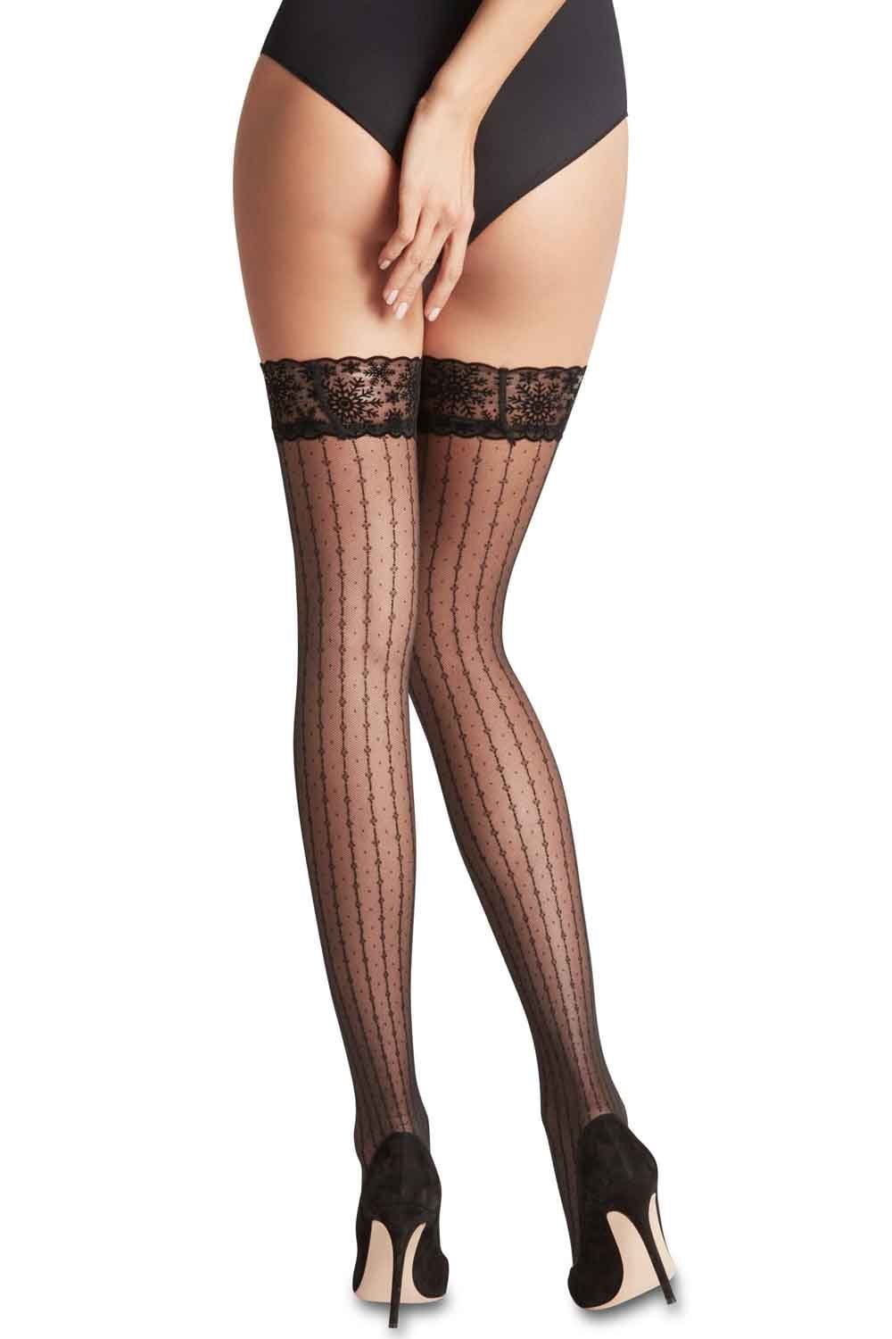 Black  20 denier hold ups with lace top worn by a person on a white background
