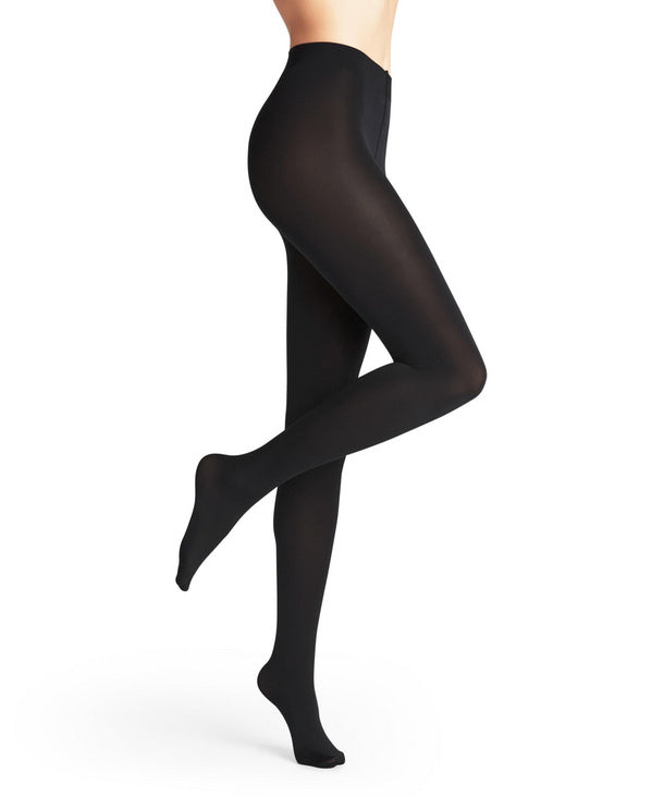 Black tights worn by a person on a white background