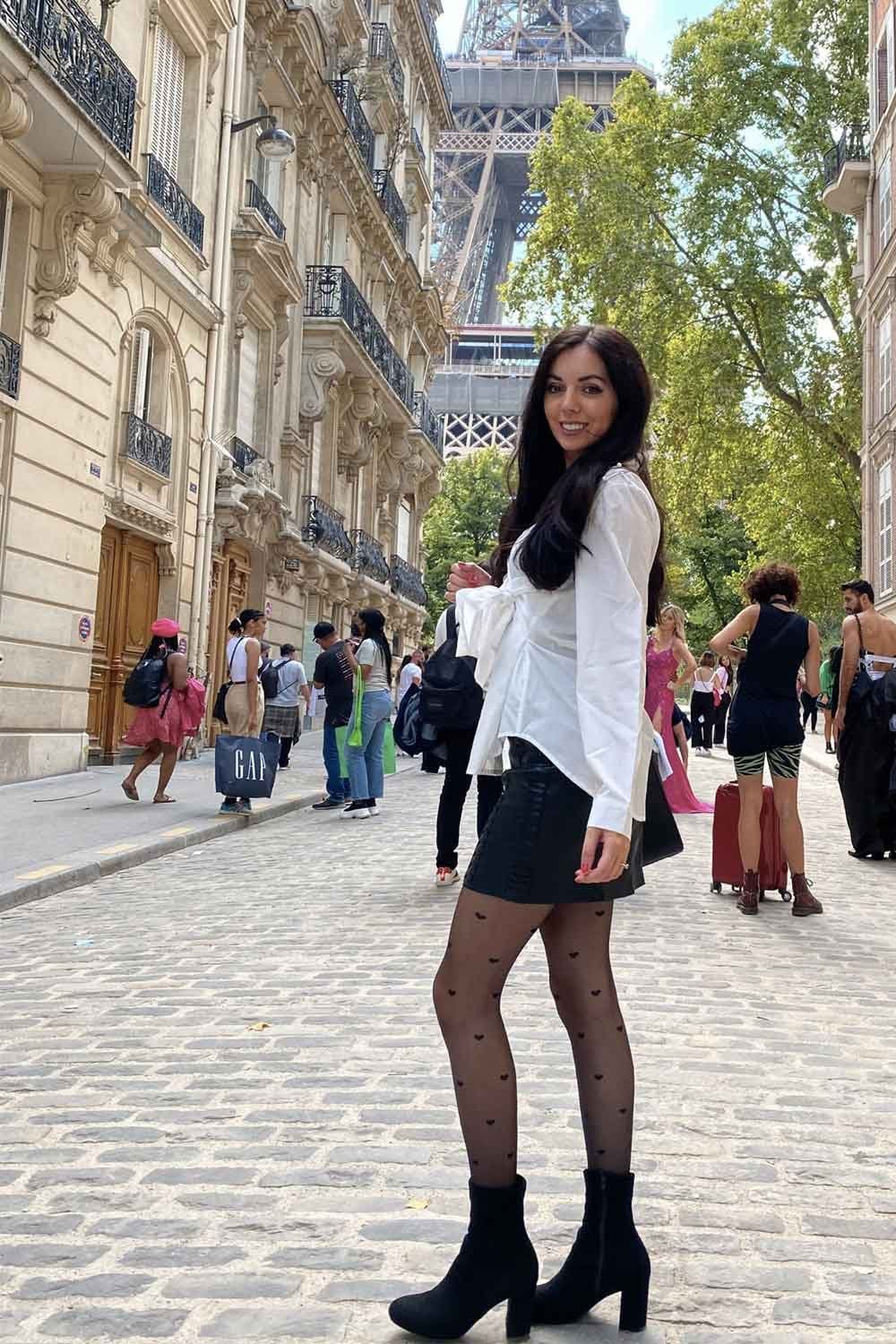 Model standing on a Paris street with the Eiffel Tower in the background wearing Allana  all over heart tights