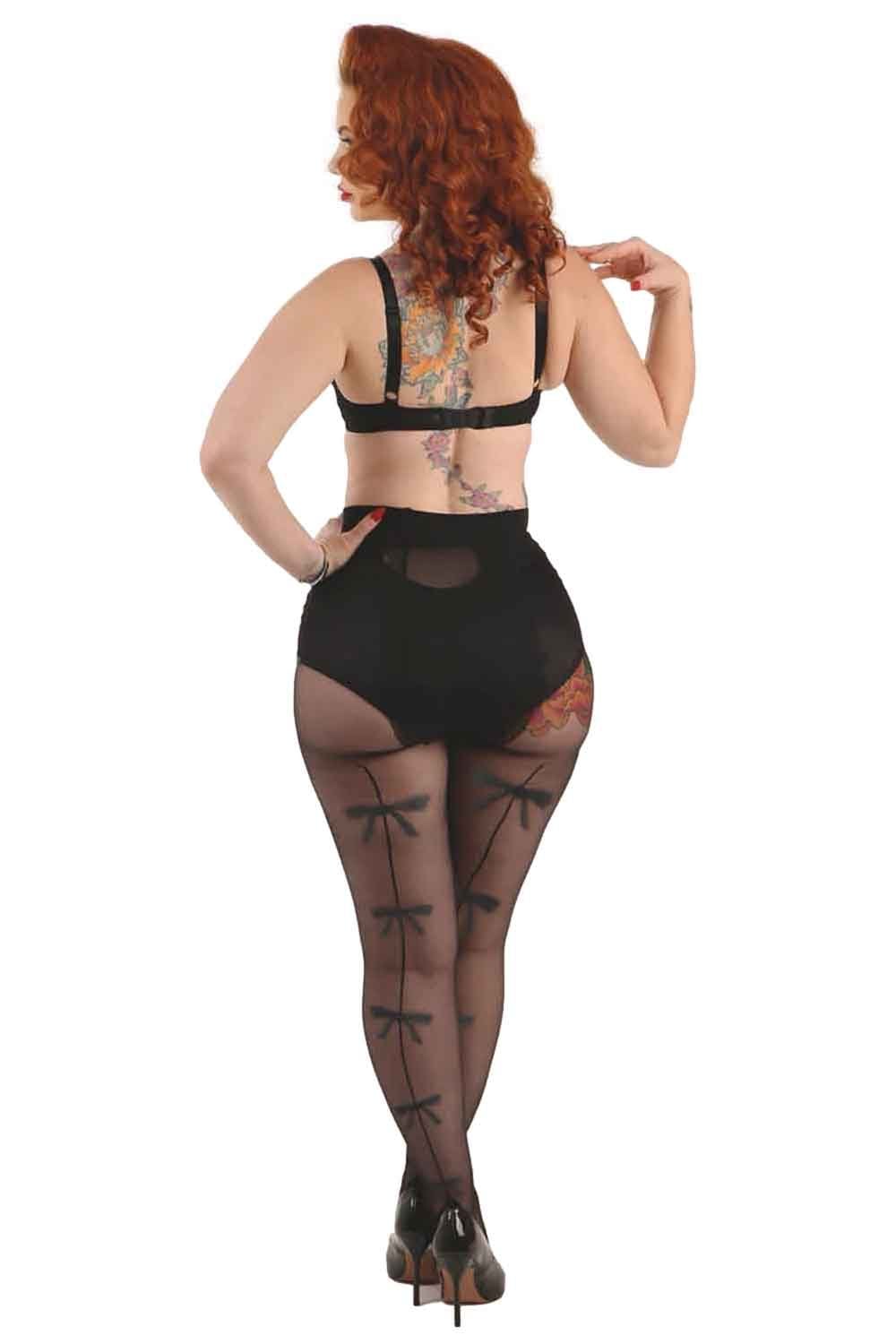 Model wearing bow backseam tights  on a white background
