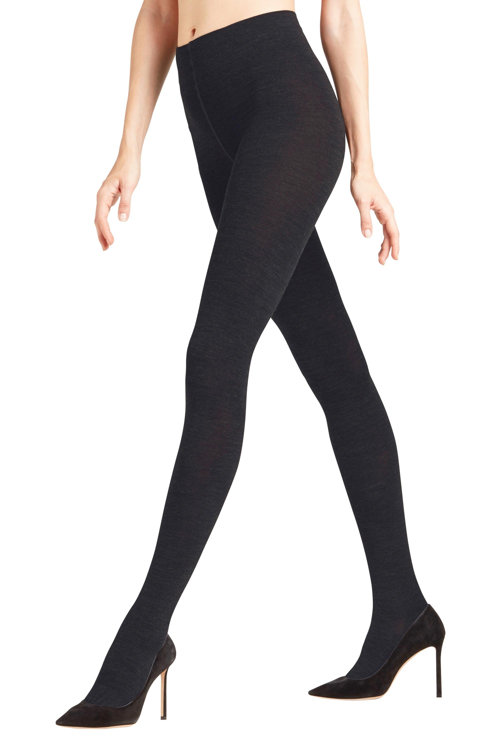 Black tights worn by a person on a white background