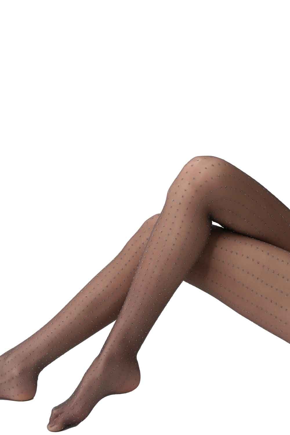 Sparkly glitter dot tights worn by a person on a white background
