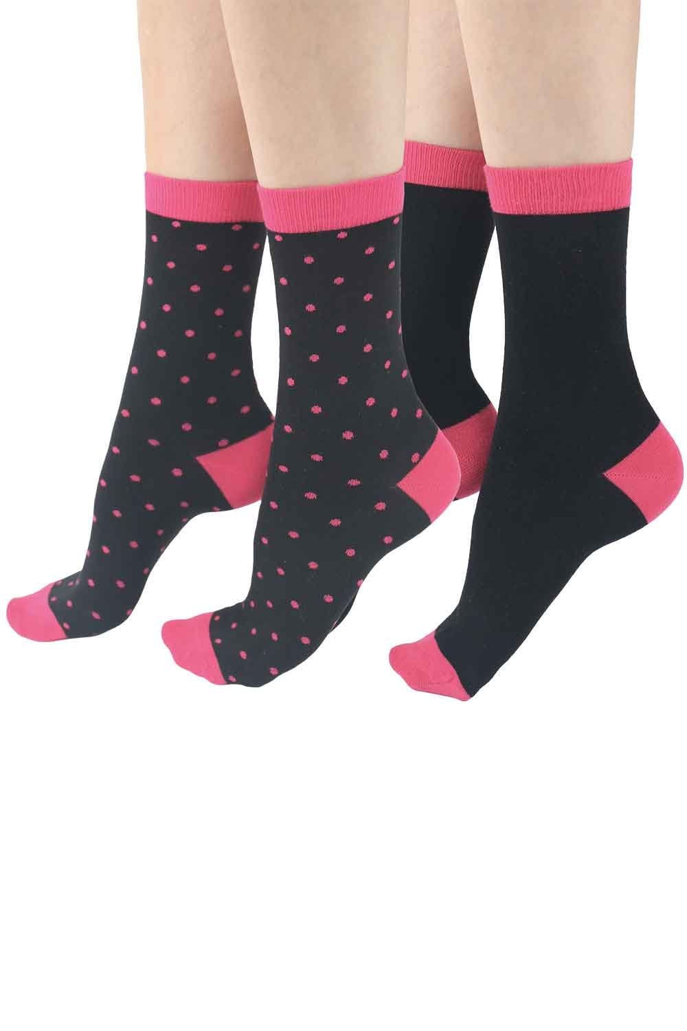 Black socks with pink accents and polka dot pattern on a white background