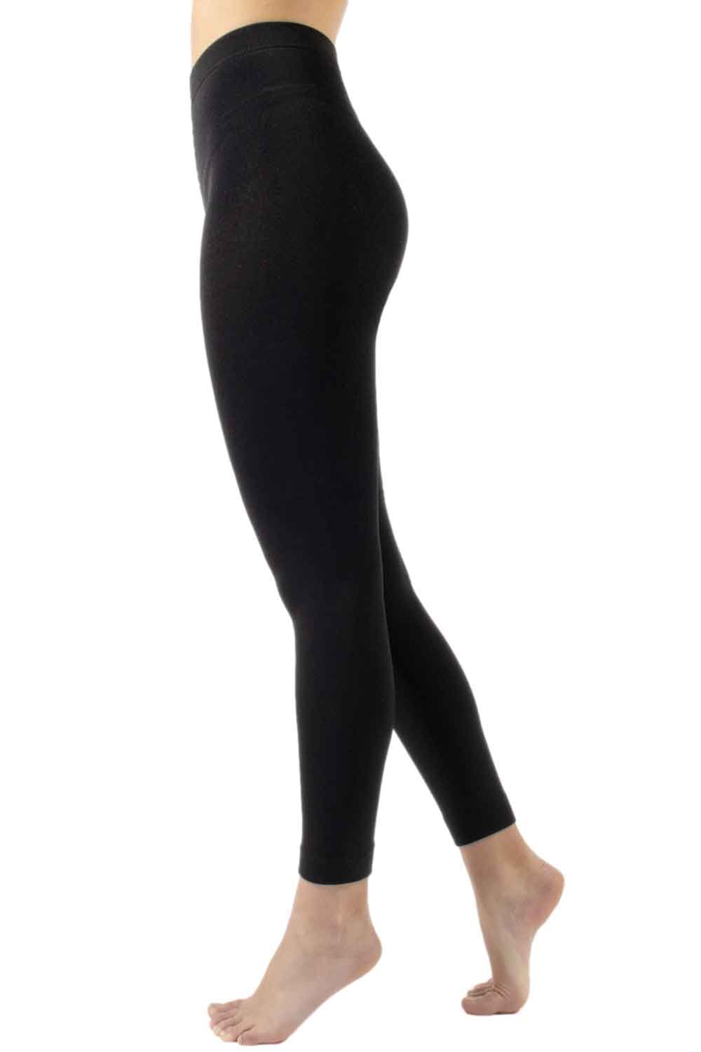 Black fleece lined footless tights worn by a person on a white background