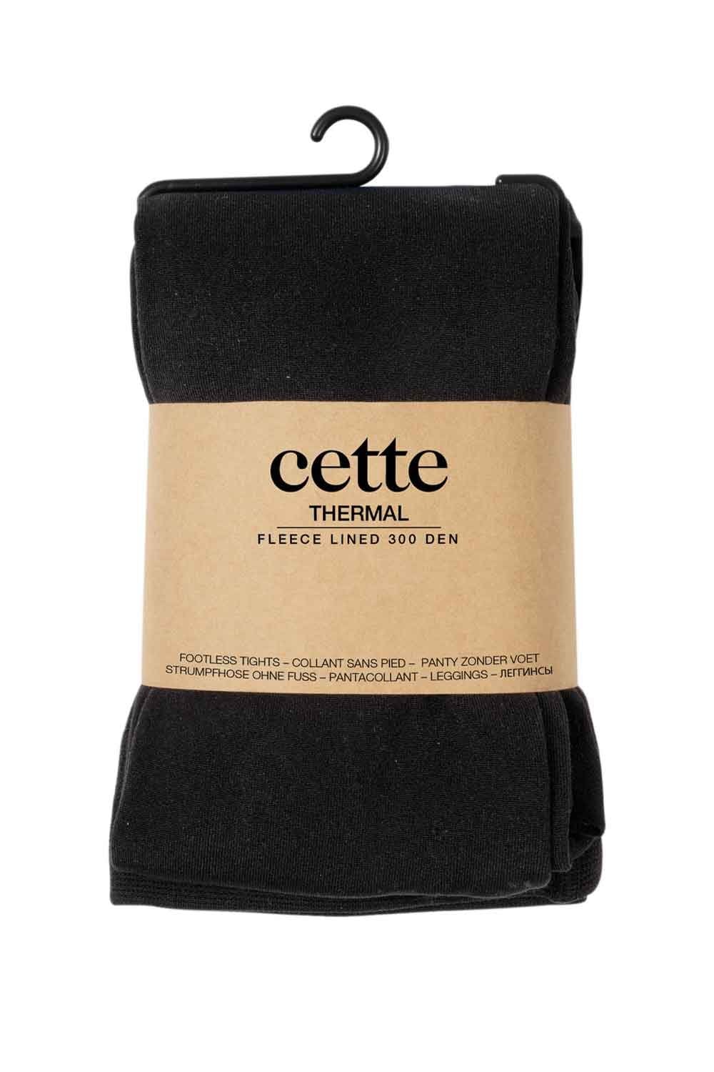 Black thermal footless tights  with 'cette' branding on a beige label against a white background