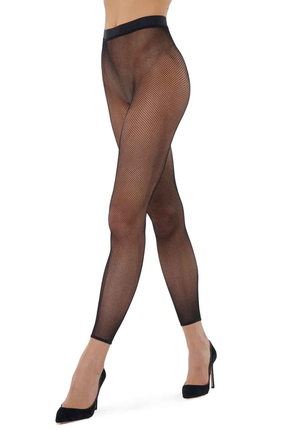 Black fishnet patterned leggings worn by a model on a white background