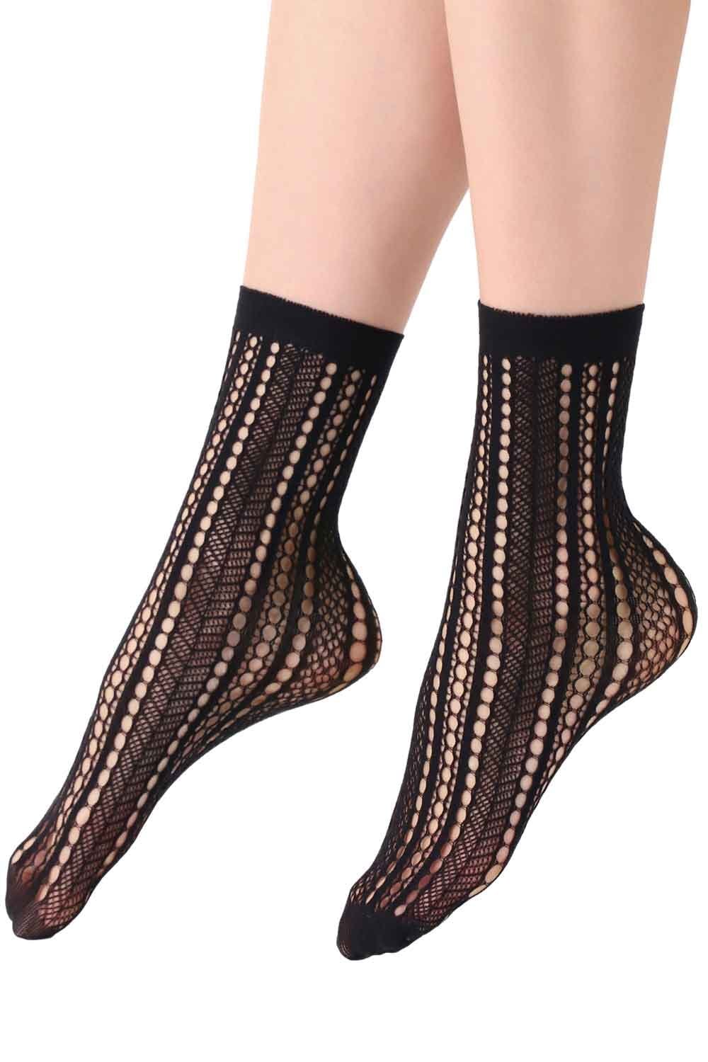Black net socks worn by a person on a white background