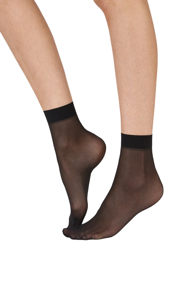 Black sheer socks on a white background