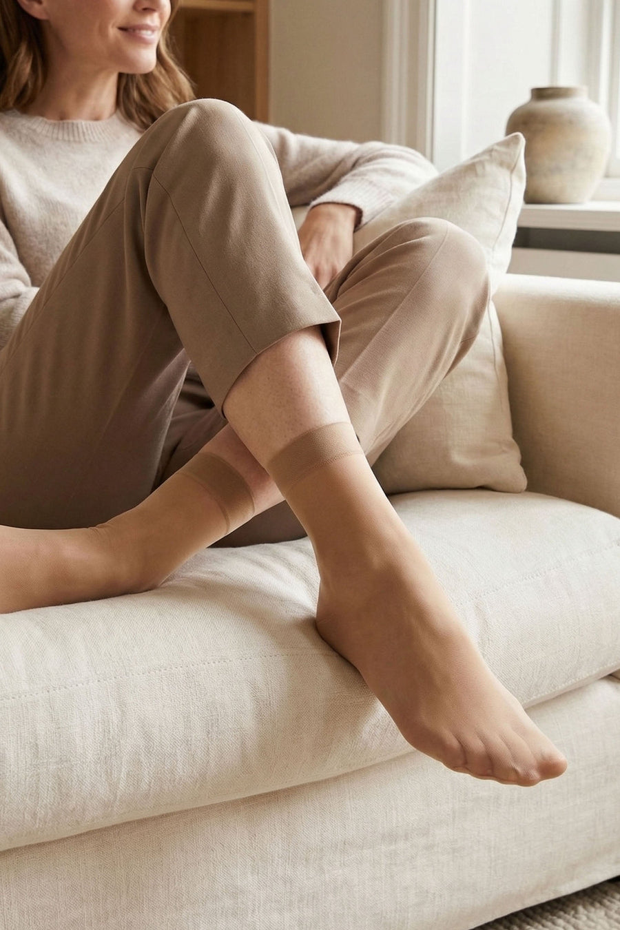 Model wearing shiny nude ankle highs