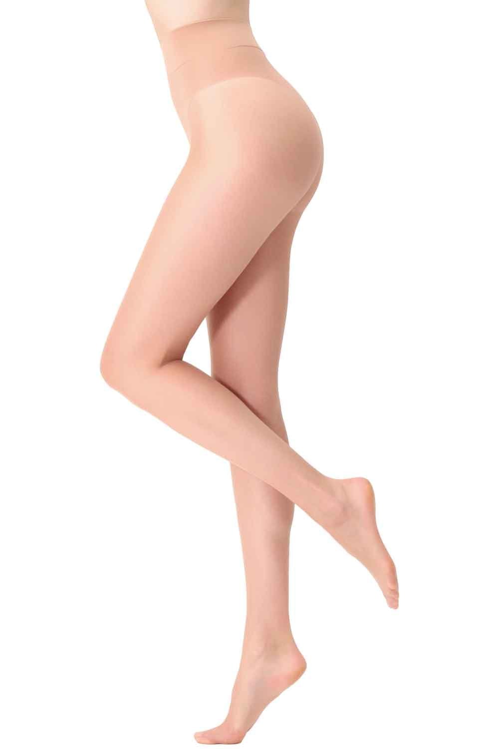 Transparent coloured tights worn by a person on a white background