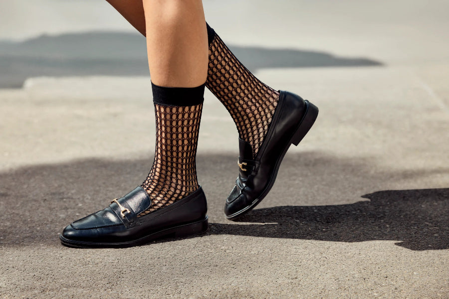 black fishnet socks with black loafers