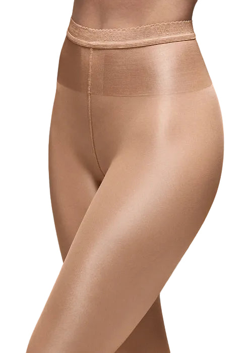 Beige shiny tights  worn on a model on a white background