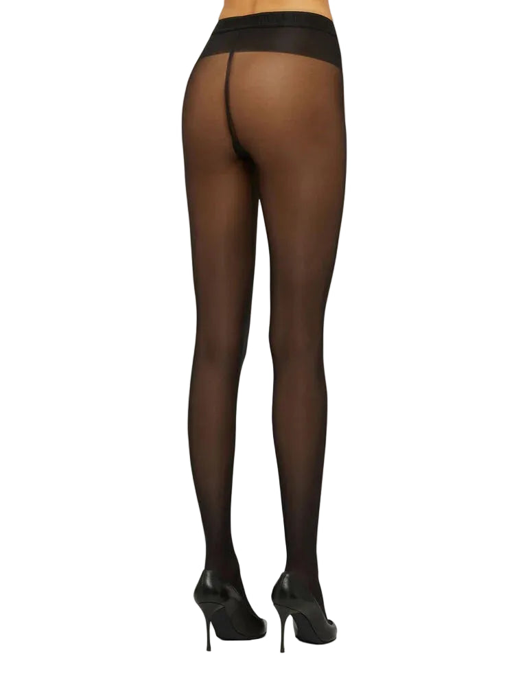 Black tights worn by a person on a white background