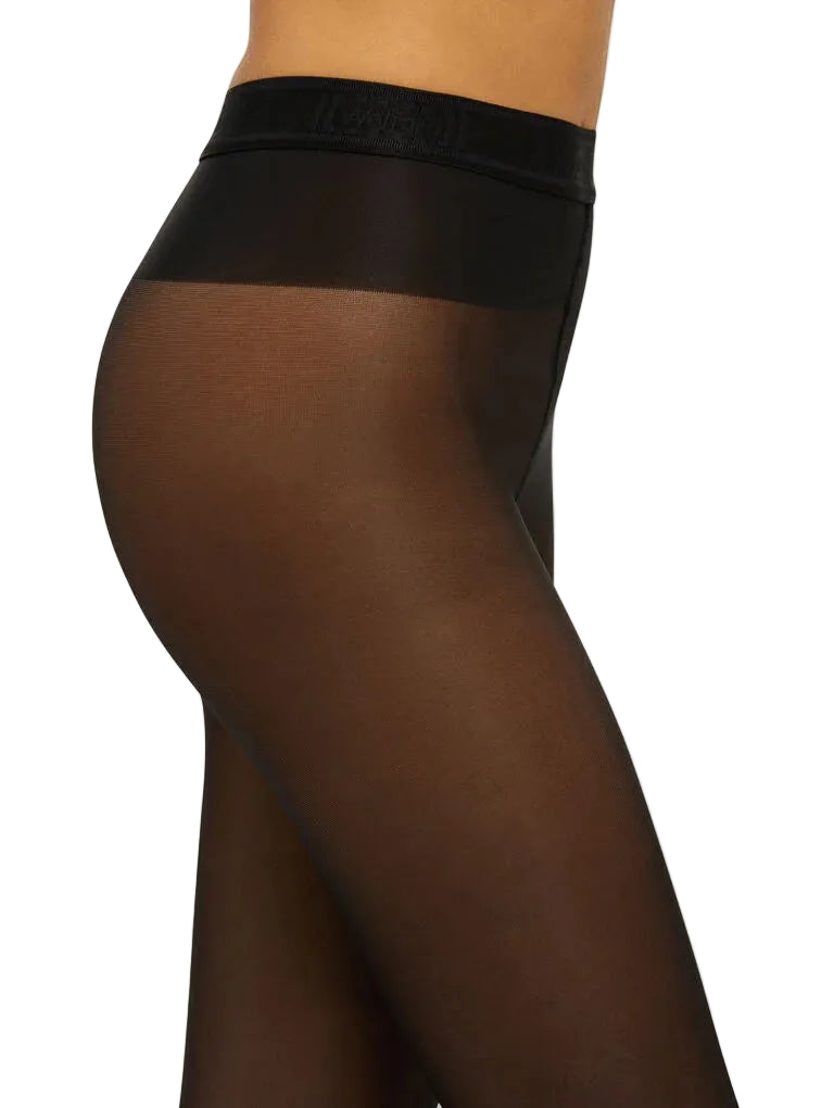 Wolford black 40 denier tights worn by a model on a white background