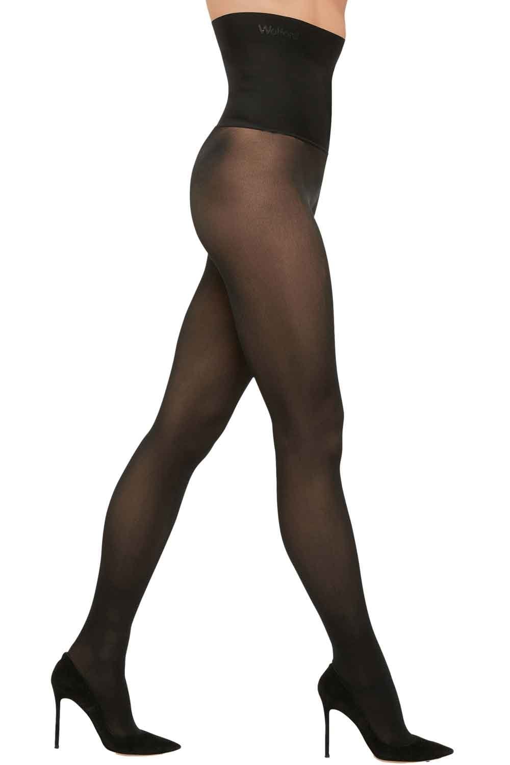 Black high waist tights worn by a model on a white background