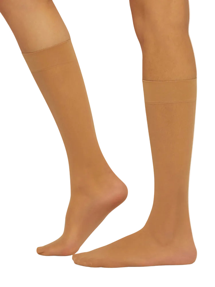 Gobi coloured knee-high socks worn by a model on a white background