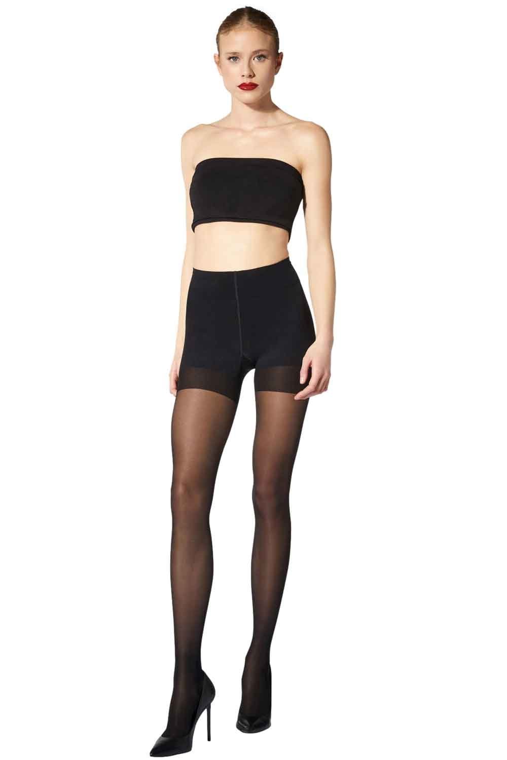Model wearing a black strapless top and black tights with a darker brief design on a white background