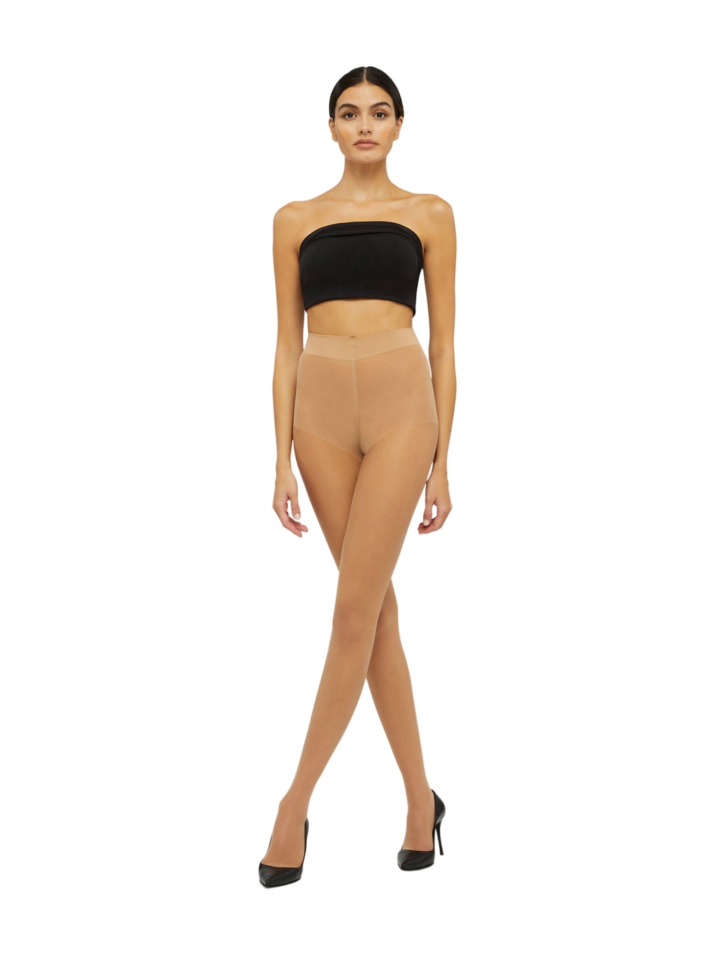 Woman wearing gobi tights  with a black top on a white background