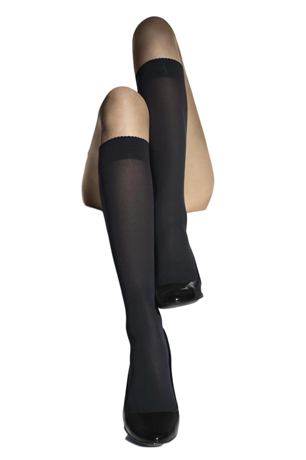 Black knee-high socks on a white background