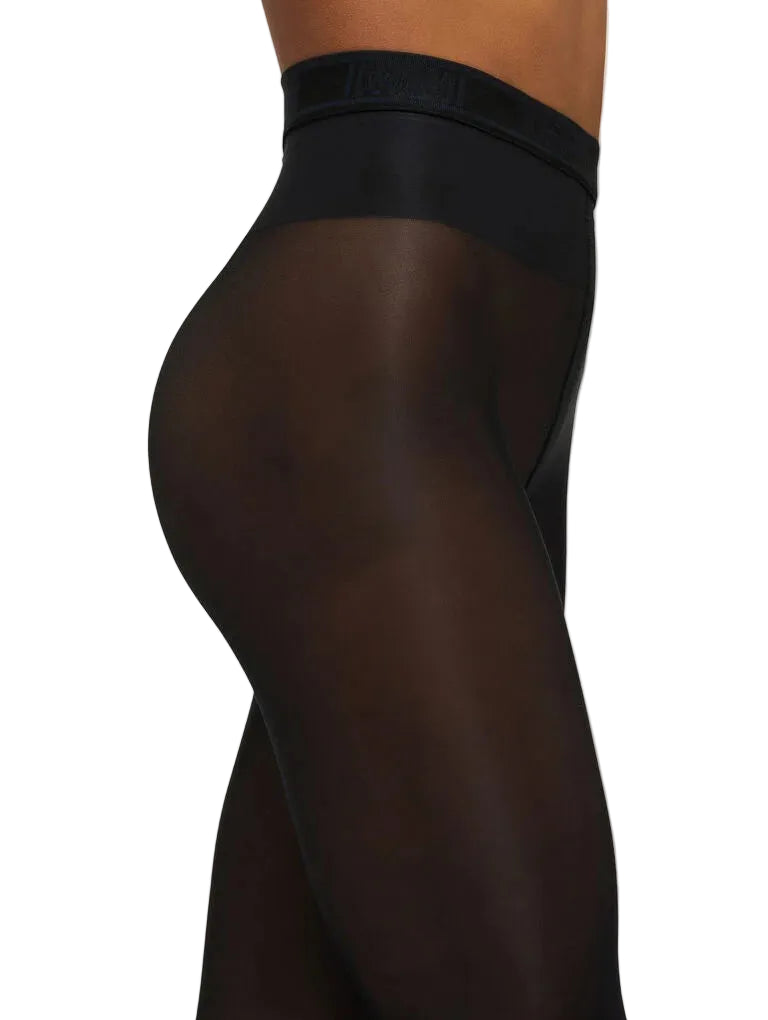 dark navy sheer tights worn by a person on a white background
