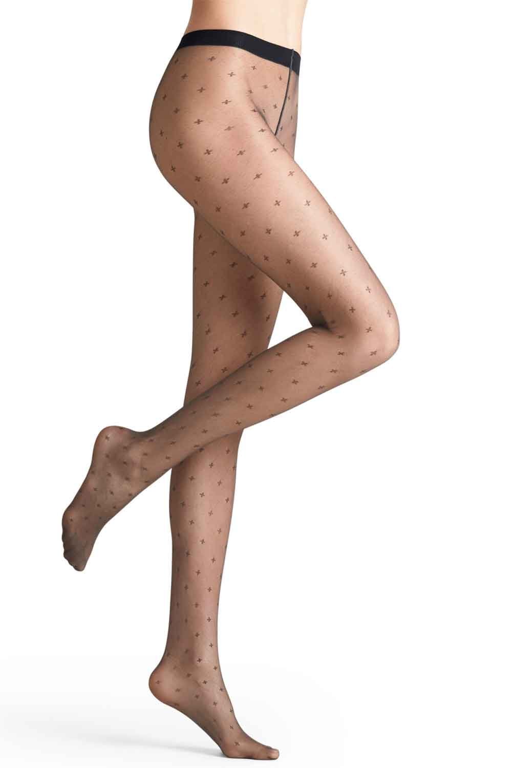 Sheer tights with subtle pattern worn by a person on a white background