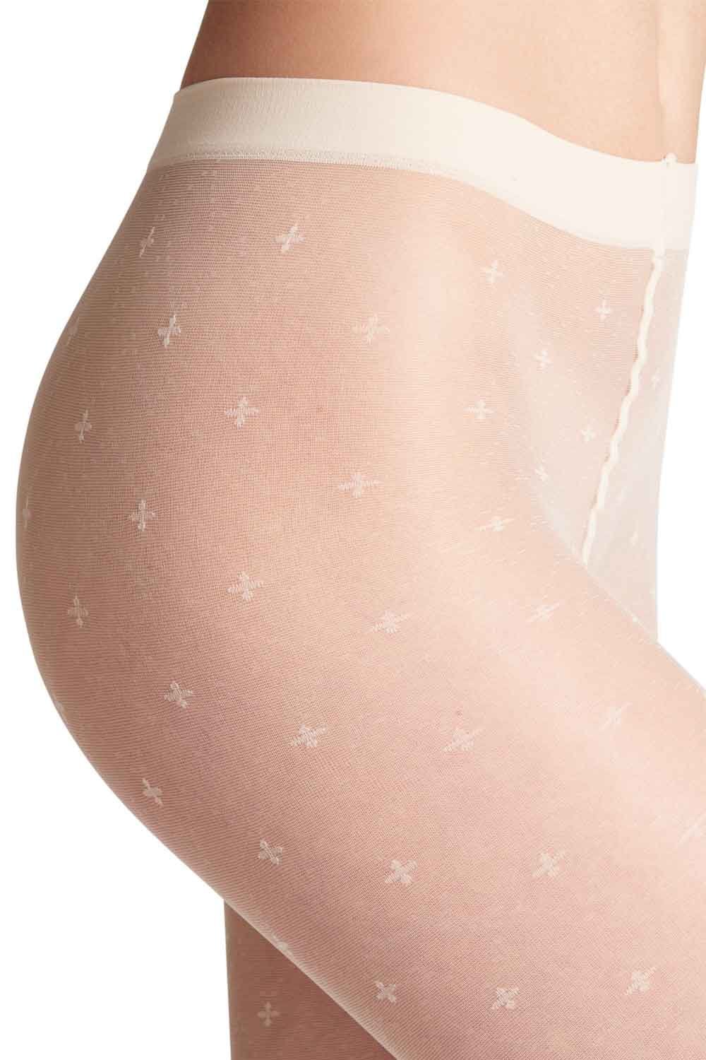 Champagne coloured tights  with a subtle pattern on a white background